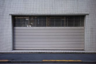 Dealing with Garage Door Panel Damage: Repair or Replace?